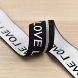 1.5 inch (40 mm) Wide Black/Beige Love Elastic Band- 1 Yard