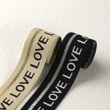 1.5 inch (40 mm) Wide Black/Beige Love Elastic Band- 1 Yard
